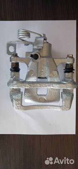 Суппорт тормозной задний левый solaris