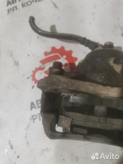 Суппорт тормозной передний левый Mitsubishi Libero