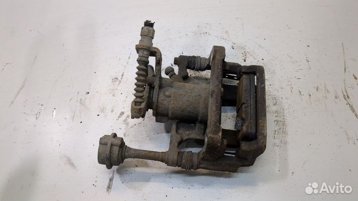 Суппорт левый задний Opel Astra J