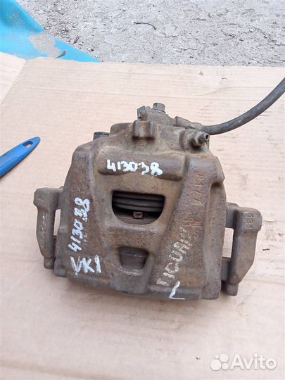 Суппорт тормозной передний левый VW Tiguan (2011