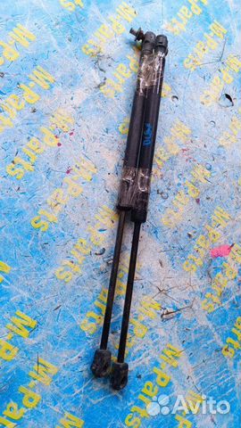 Амортизатор двери багажника Mazda Verisa DC5W DC5R