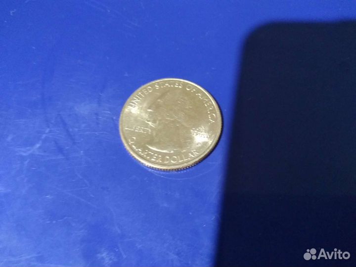 Монета в 25 центов или в четверть от доллара США