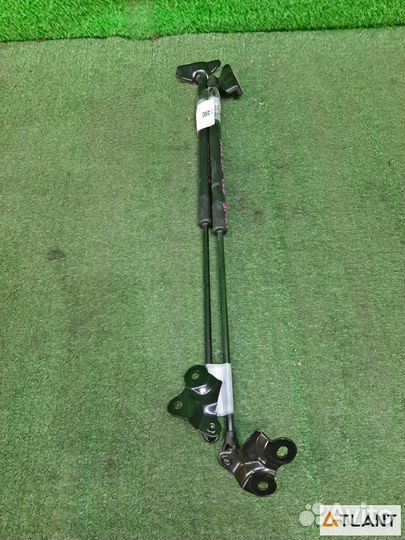 Амортизатор двери левый toyota corolla