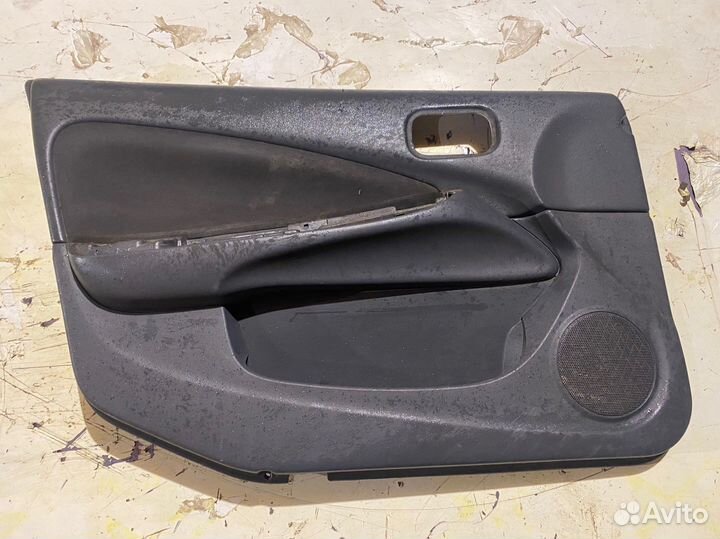 Обшивка двери передняя левая Almera n16