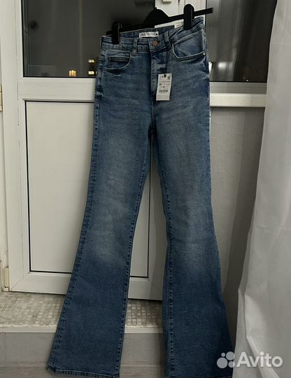 Джинсы клеш