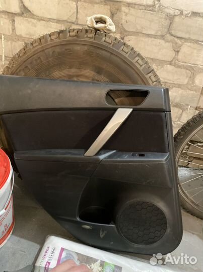 Обшивка двери Mazda 3