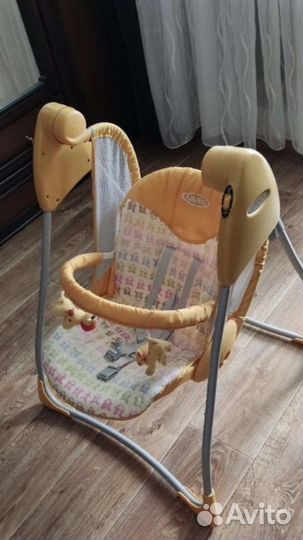 Детская кроватка с маятником и качели