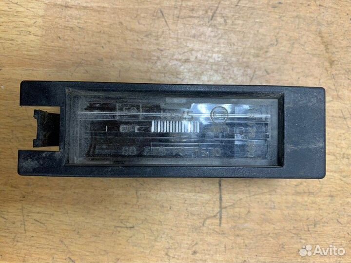 Фонарь подсветки номера Opel Vectra C