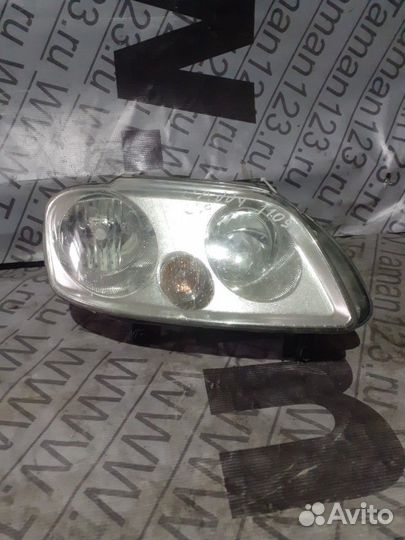 Фара VW Caddy 2003