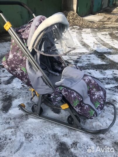 Зимняя детская коляска на полозьях с колесами