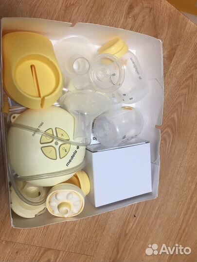 Молокоотсос medela электрический