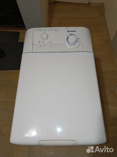 Стиральная машина Канди с вертикальной загрузкой