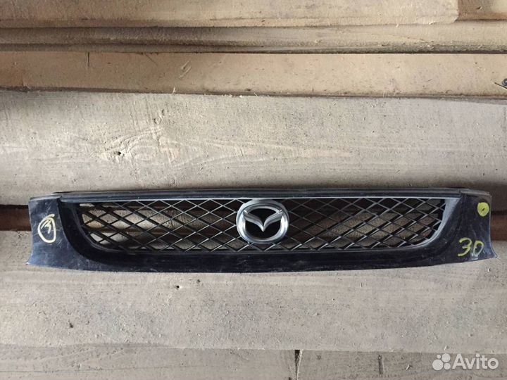 Решетка радиатора Mazda Capella GW 1999г