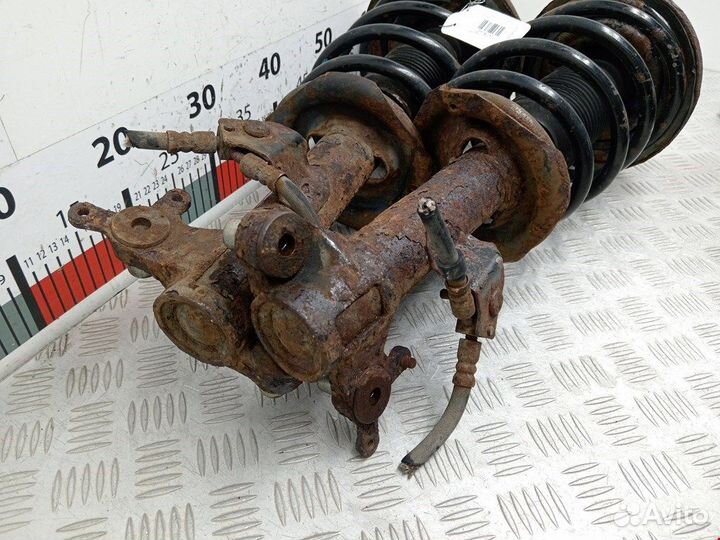 Стойка амортизатора переднего левого Nissan Primera