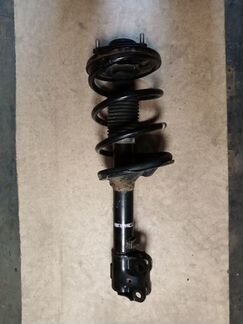 Передний амортизатор левый Mitsubishi Outlander XL